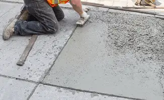 Professional repairing a concrete floor in Philadelphia, PA